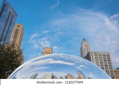 Downtown skyscrapers reflected in the mirror surface of The Bean sculpture in Millennium Park in Chicago, Illinois. - Powered by Shutterstock