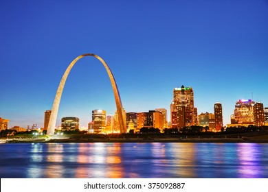 Downtown St Louis, MO With The Old Courthouse And The Gateway Arch At Sunset