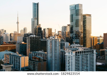 Downtown Toronto skyline with sunset sky reflection on buildings