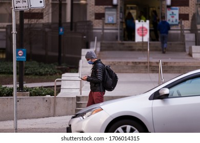 DOWNTOWN VANCOUVER, BC, CANADA - APR 01, 2020: Person Wearing A Medical Face Mask Outside St Pauls Hospital In Vancouver During The Covid 19 Pandemic.