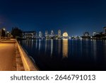 Downtown Vancouver British Columbia Canada view of science world at night with reflection in water