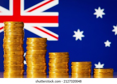 Downward Chart Made Of Golden Coins On The Background Of Australian Flag. Financial Crisis, Negative Statistics, Economic Problems Of The Country Australia