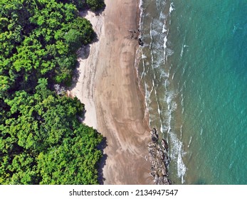 Downward Drone Shot Of Etty Beach Ocean And Rainforest In Far North Queensland