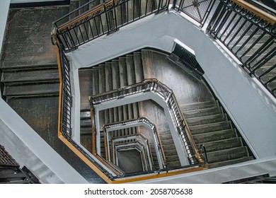 A downward perspective view of an old woodern staircase