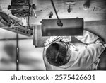 Downward view of a clock workshop. Clockmaker repairing wrist watch.