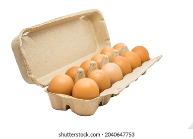Dozen of eggs in a carton on a white background. 