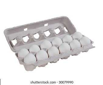 A dozen eggs in a crate isolated on white background
