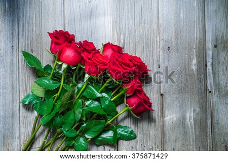 Dozen Red Roses on Wood Background / Proposal/ Selective focus