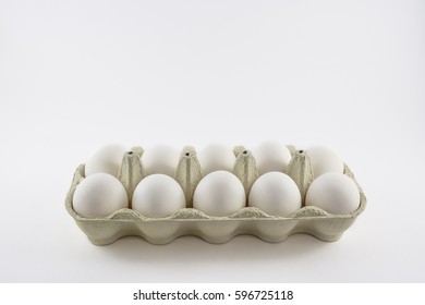 Dozen White Eggs In A Box Isolated.