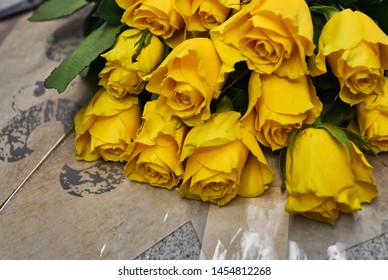 Dozen Yellow Roses On Cellophane Paper