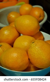 Dozens Navel Oranges In Blue Plastic Bowl