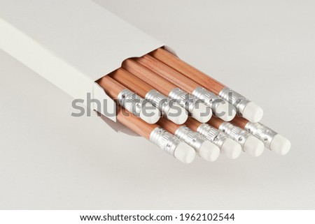 a dozens of pencils ( with white erasers)