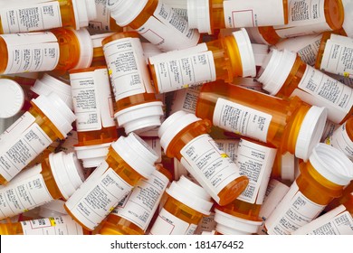 Dozens of prescription medicine bottles in a jumble. This collection of pill bottles is symbolic of the many medications senior adults and chronically ill people take.  - Shutterstock ID 181476452