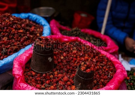 Dozens of spicy looking dried red chili pepper, placed in a jute bag, found at a local spices market in Kathmandu, Nepal. Local cuisine, local taste and local shop.