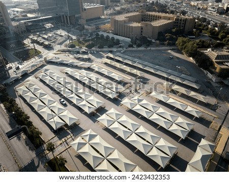 A dozens Umbrellas in a Tranquil Riyadh Parking Lot