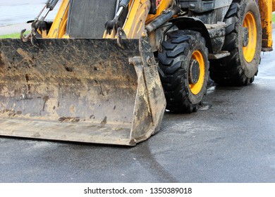 Dozer Blade Of The Tractor. Road Repair Extension In Gatchina, Russia. Reportage.