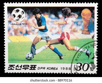 DPR KOREA - CIRCA 1988: A Stamp Printed By DPR KOREA Shows Football Players. World Football Cup In Italy, Series, Circa 1988