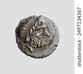 Drachm 3rd century B.C. Silver Obverse: Diademed head of Zeus or Minos in profile, facing right. Reverse: Apollo seated on a rock, with his head facing forwards and legs bent to his right; he wears bo