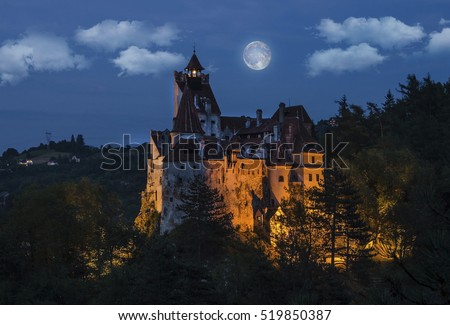 Dracula's medieval castle at night with full moon - Bran , Transylvania. Romania.