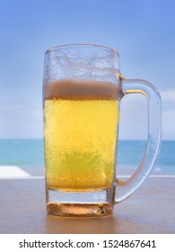 Draft Beer Drinking On The Beach