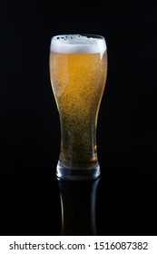 Draft Beer In Glass On Black Background