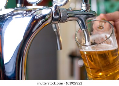 Draft Beer Pour In A Glass From The Crane (close-up)