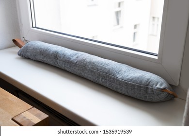 Draft Excluder Under Window Blocking Cold Air From Traveling Around