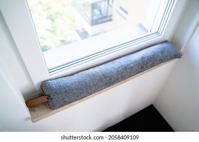 Draft Excluder Under Window Blocking Cold Air From Traveling Around