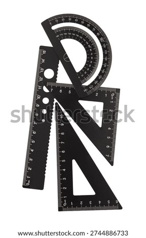 Drafting tools including protractor, rulers, and set squares on a white background