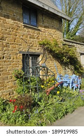 Drag Harrow & Potato Harvester Against Ironstone Cottage Wall