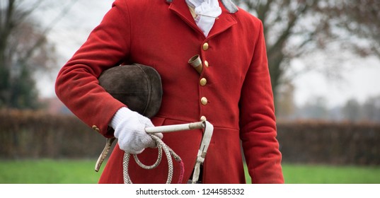 Drag Hunt Portrait Drive Master. Red Coat Fox Hunt. With Cap, Whip And Horn. Hunting Scene. Tradition. Netherlands Rural Area. 