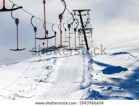Drag lift no people, ski resort closed. Concept: pandemic, lockdown, covid-19