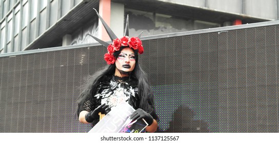 Drag Queen With Flower Crown And Black Lips In The Scenario At LGBT+ Parade In Mexico City, 2018