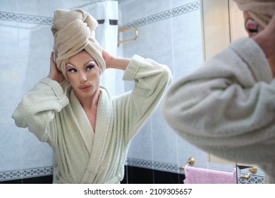 Drag Queen Person Getting Ready After Shower In Front Of The Bathroom Mirror.