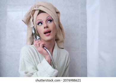 Drag Queen Person Talking On A Shower Head Pretending To Be A Phone.