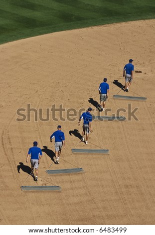Dragging the baseball field during seventh inning stretch