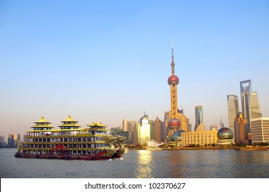 Dragon Boat Through The Shanghai Skyline