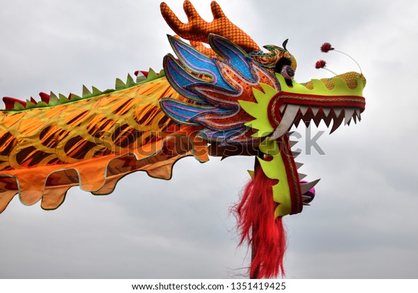 Dragon dance performance on the occasion of Nian\
Li. Dragon dance is a form of traditional dance in Chinese culture.\
It symbolizes the imagined movements of the river spirit in a\
sinuous manner.