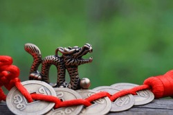 Dragon Figurine With Chinese Coins. A Religious Symbol.