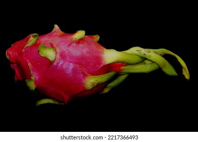 Dragon Fruit In Black Background. .It Is Pink Skinned Fruit With White Flesh. Dragon Fruit Is Used To Flavor And Color Juices And Alcoholic Beverages.