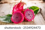 Dragon fruit with leaf on wooden background