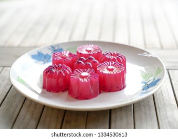 Dragon fruit (red) agar agar (Jelly) sweet dessert served in multiple shapes ready to be eaten - Shutterstock ID 1334530613