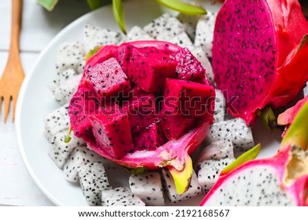 dragon fruit slice on white plate with pitahaya background, fresh white and pink red purple dragon fruit tropical in the asian thailand healthy fruit concept