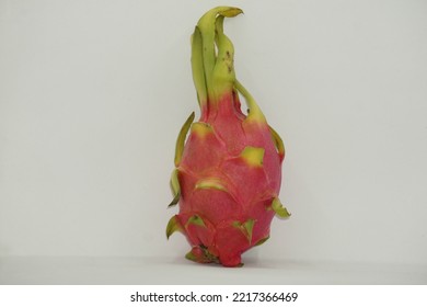 Dragon Fruit In White Background. It Is Pink Skinned Fruit With White Flesh.Dragon Fruit Is Used To Flavor And Color Juices And Alcoholic Beverages.