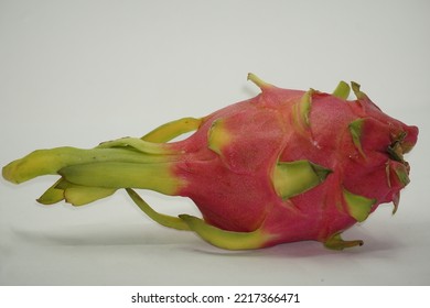 Dragon Fruit In White Background. It Is Pink Skinned Fruit With White Flesh. Dragon Fruit Is Used To Flavor And Color Juices And Alcoholic Beverages.