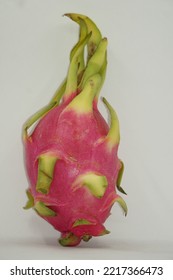 Dragon Fruit In White Background. It Is Pink Skinned Fruit With White Flesh. Dragon Fruit Is Used To Flavor And Color Juices And Alcoholic Beverages.