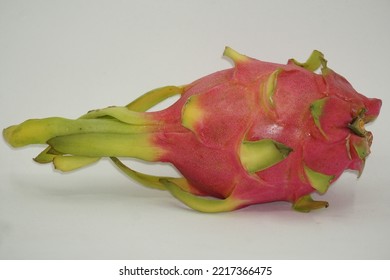 Dragon Fruit In White Background. It Is Pink Skinned Fruit With White Flesh. Dragon Fruit Is Used To Flavor And Color Juices And Alcoholic Beverages.