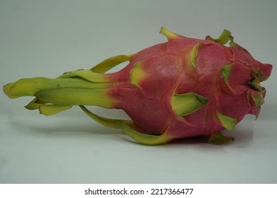 Dragon Fruit In White Background. It Is Pink Skinned Fruit With White Flesh. Dragon Fruit Is Used To Flavor And Color Juices And Alcoholic Beverages.