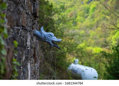Dragon head on the outer wall of Reichenstein Castle / Germany on the Rhine