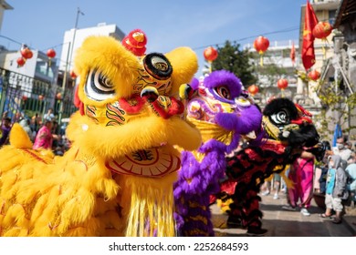 Dragon and lion dance show in chinese new year festival (Tet festival ), lion Dance - dragon and lion dance street performances in Vietnam. Holidays and celebrations concept. Selective focus.